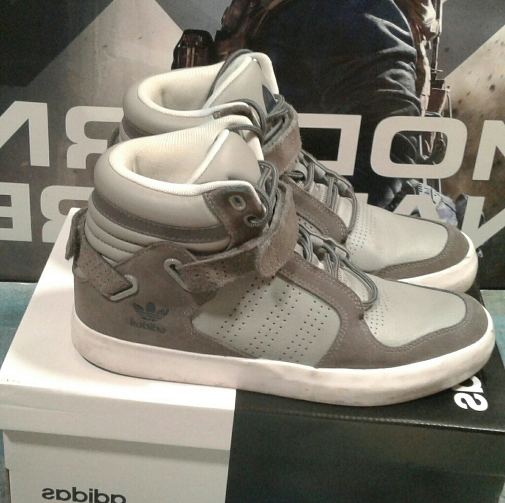 Grey adidas high tops.